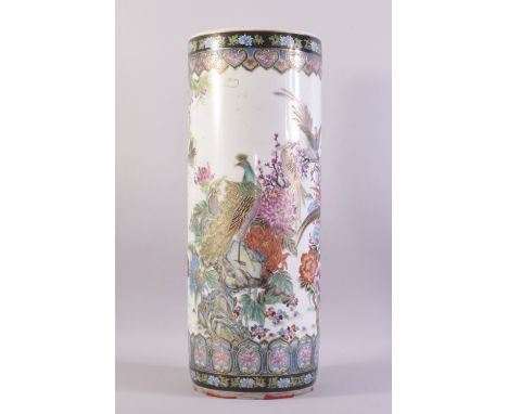 A CHINESE FAMILLE ROSE PORCELAIN WALKING STICK STAND, vividly decorated with peacocks amongst native flora with gilt highligh