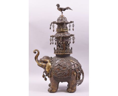 A FINE MEIJI BRONZE ELEPHANT KORO, the elephant cast with elaborate robes, carrying a three tier pagoda upon the back with ph