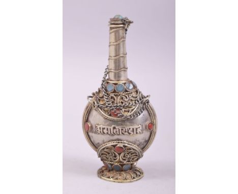 AN ISLAMIC WHITE METAL AND ENAMEL SCENT BOTTLE, 9.5cm high.