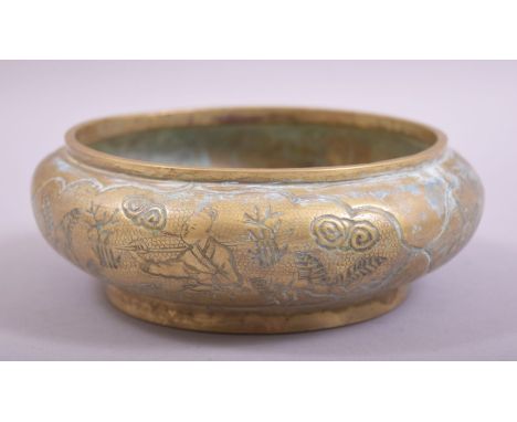 A CHINESE EMBOSSED AND CHASED BRONZE BOWL, with scenes of men on horseback in outdoor settings, the base with impressed six c