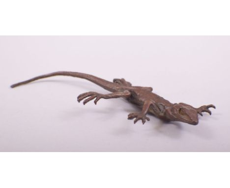 A JAPANESE BRONZE MODEL OF LIZARD, stamped underside, 16cm long.