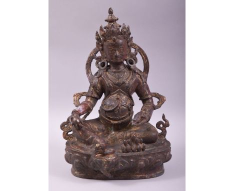 A TIBETAN BRONZE BUDDHA, with traces of red paint and gilt decoration, 30cm high.