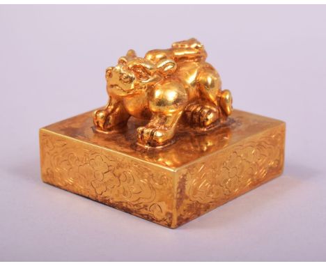 A CHINESE GILT BRONZE LION DOG FORMED SEAL.