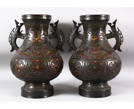 A PAIR OF JAPANESE CHAMPLEVE BRONZE CLOISONNE TWIN HANDLE VASES, the body decorated with enamelled floral sprays and phoenix,