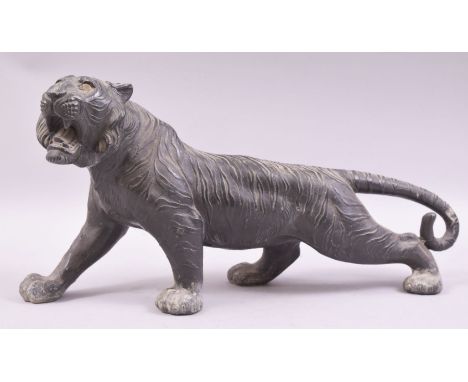 A JAPANESE BRONZE MODEL OF A TIGER, in a predatory stance, 43cm long.
