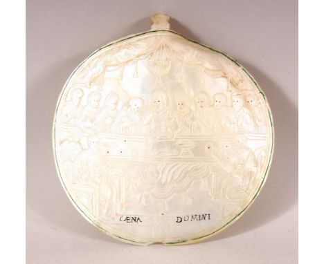 A FINE 18TH/19TH CENTURY JERUSALEM CARVED MOTHER OF PEARL SHELL, depicting the last supper, jesus central, 15.5cm x 15.
