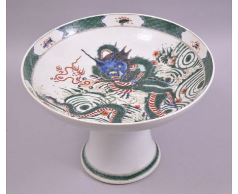 A LARGE CHINESE FAMILLE VERTE PORCELAIN PEDESTAL FRUIT DISH, the dish painted with a dragon holding the flaming pearl of wisd