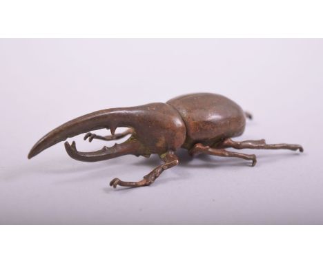 A JAPANESE BRONZE MODEL BEETLE, mark to underside, 7.5cm long.