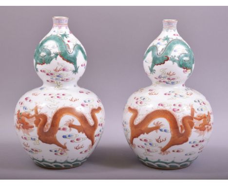 A GOOD PAIR OF CHINESE PORCELAIN GUORD SHAPE VASES, decorated with dragons and the flaming pearl of wisdom amongst stylised c