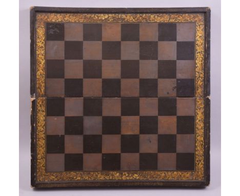 A CHINESE LACQUER AND GILT FOLDING CHESS BOARD, the interior with a backgammon board, 50cm wide.