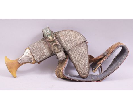A LATE 19TH CENTURY YEMENI JAMBIYA, the curving blade 17cm with a raised central ridge, the hilt with white metal mounts, con