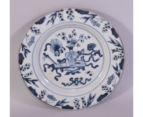 A CHINESE BLUE AND WHITE PORCELAIN DISH, the centre painted with an urn of flowers and scroll as well as other objects, 23cm 