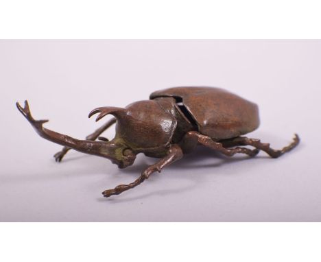 A JAPANESE BRONZE MODEL OF BEETLE; rhinoceros beetle, with an opening hinged back section, 10cm long.