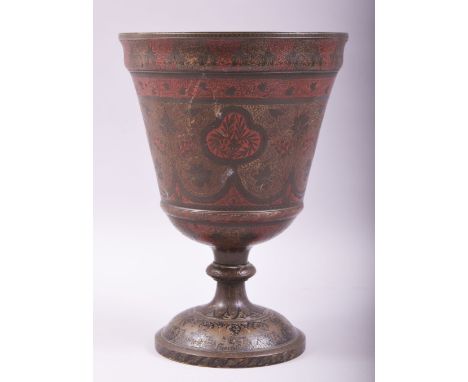 A LARGE INDIAN BRONZE ENAMELLED PEDESTAL VASE / CUP, with engraved and chased decoration and areas of red and black enamel, 2