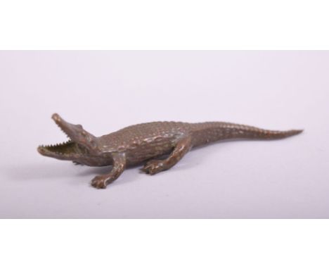 A SMALL JAPANESE BRONZE MODEL OF AN ALLIGATOR, 8.5cm long.