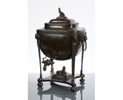 LATE 19TH CENTURY PATINATED METAL SAMOVAR
with lug handles, the finial modelled as a sphinx, the fluted legs with figural det