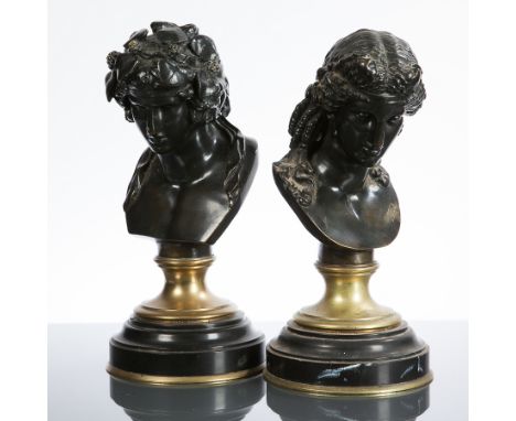TWO 19TH CENTURY BRONZE BUSTS OF NEOCLASSICAL FIGURES
of a male and female, each over a circular brass and bronze base, 30cm 