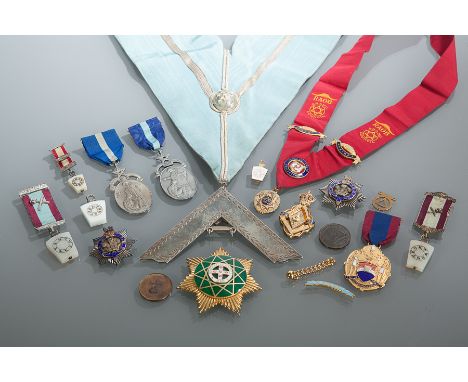 EARLY TO MID 20TH CENTURY MASONIC BADGES AND MEDALS
including a large silver gilt badge with green enamel nine point star wit