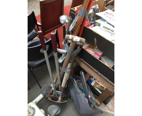 A bundle and a bag of various garden tools 