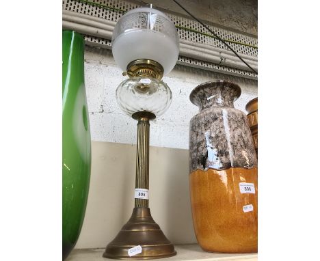 A vintage parafin lamp with shade and flute 
