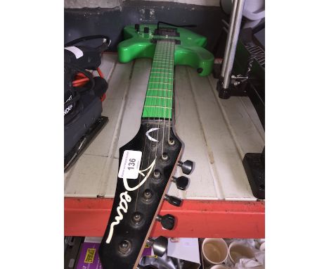 A neon green Dean electric guitar 