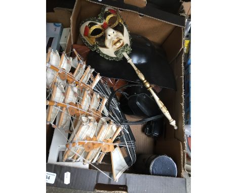 A box of misc to include a Olympus 35mm camera and a Paragon macro lense, model yacht, wooden masks, etc 