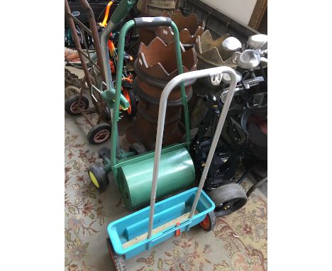 A grass roller and a seed spreader 