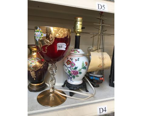 Pot lamp, two red glass vases and a ship 