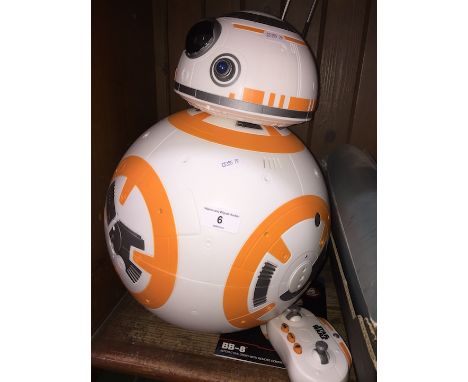 A Star Wars BB-8 toy with remote and instructions manual 