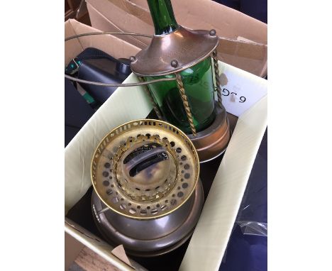 A musical hanging ornamental bottle in brass cage and a parafin lamp - no shade 
