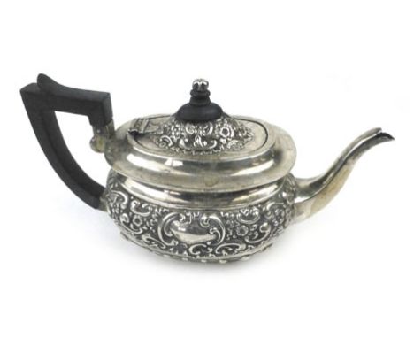 A silver hallmarked embossed teapot, Chester 1900 makers mark G N R H, approx weight 358 grams 