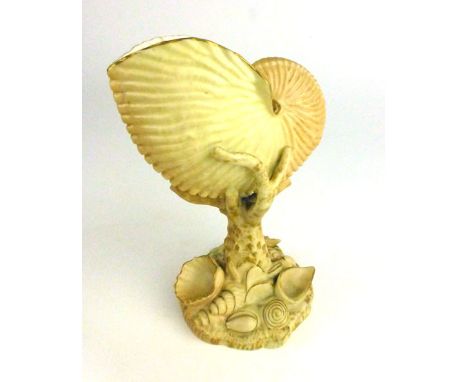 A Royal Worcester blush ivory nautilas vase of shell form on a naturalistic plinth, p.d.c.m. 1897, h. 17 cm