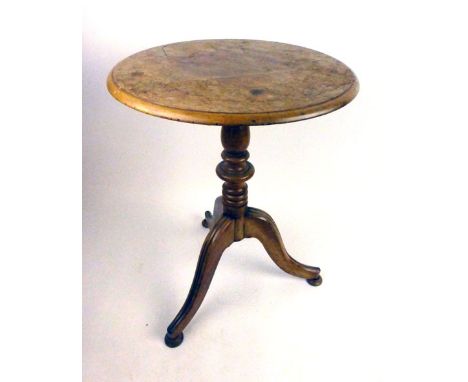 An early 19th century mahogany tilt top tripod table, the moulded top over turned column on three moulded splay legs, h. 60 c