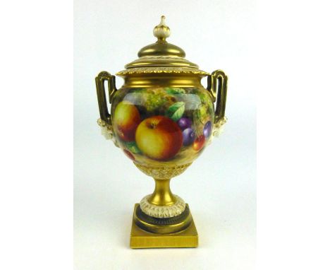 John H. Freeman (b.1911) for Royal Worcester, an urn and cover of Neo-Classical form decorated with fruits on a square plinth