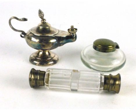 A silver plated table lighter in the form of genie lamp, together with a glass perfume bottle with plated tops to the end, an