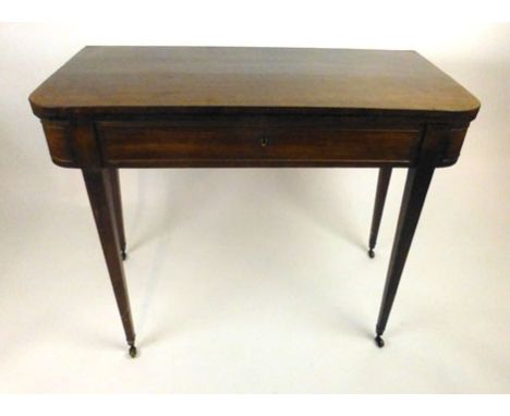 A Regency mahogany and ebony strung tea table the flip over top supported with a double gate action, above a single drawer on