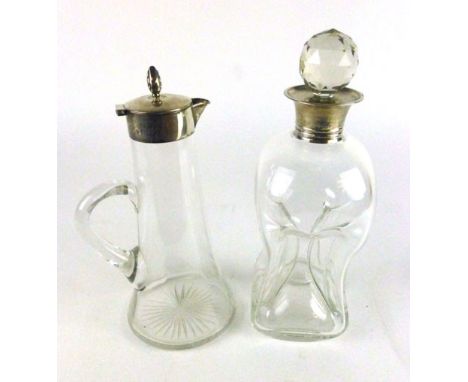 A silver hallmarked topped glass claret jug, dated Birmingham 1904 together with a silver rimmed glass waist sided decanter w