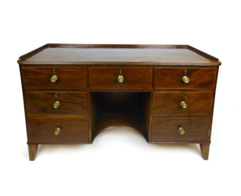 A George III and later mahogany and boxwood line inlaid sideboard, the galleried and moulded top over three long drawers abov