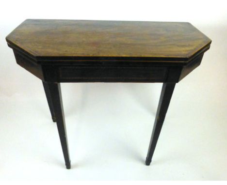 A Regency mahogany, boxwood and ebony strung card table, the flip over top supported on a double gate action with a baize ins