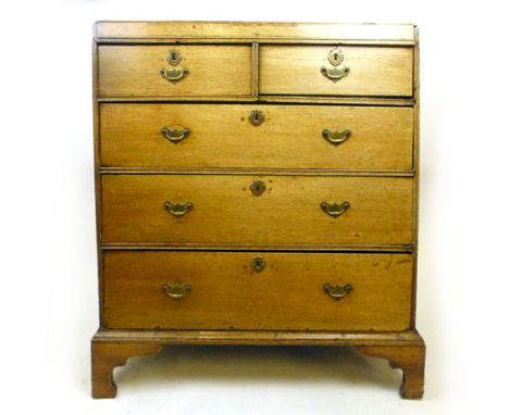 An 18th century oak caddy top chest of drawers, with two over three graduated drawers on shaped bracket feet. h. 103 cm, w. 9