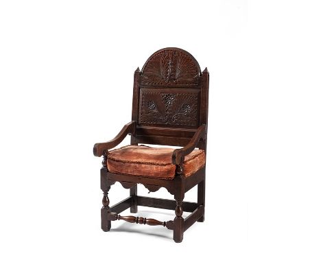 An unusual William and Mary oak high-back armchair, South Lancashire, circa 1690
The arms set low and with deep arched toprai