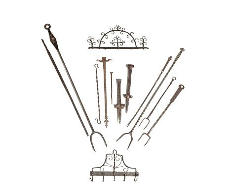 Two steel flesh forks, 17th century, one dated 1696
56cm and 48cm long, together with an Ell rule, indistinctly marked, proba
