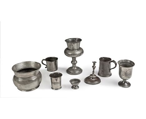 Various pewter items, 18th and 19th century
Including a candlestick, a cup, a pint mug, a large goblet, a cauldron and an eng
