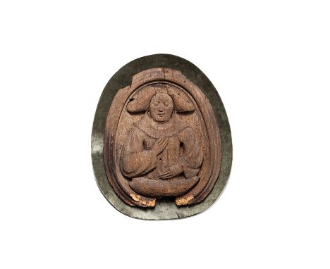 An English carved oak figure of an angel, circa 1480
Within a moulded frame and with stippled background, mounted on velvet b