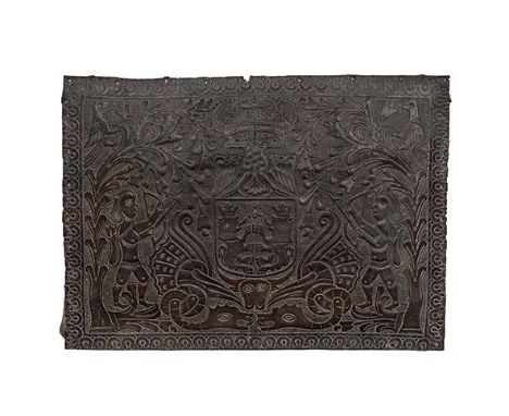 An embossed leather panel, Spanish, 17th century
Depicting a coat of arms in central cartouche flanked by birds, trees and tw