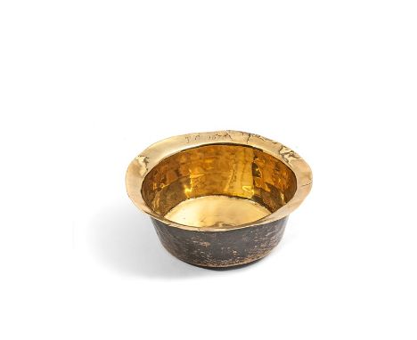 A small brass bowl, 17th century
Engraved to the rim TC 1676,&nbsp;15.5cm diameter, together with a small brass candlestick, 