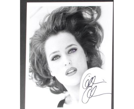 Gillian Anderson - The X Files - autographed 8x10" black and white glamour photograph. Signed in black ink to a light area, u