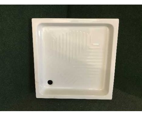 A square ceramic shower tray 
