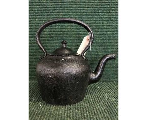 A cast metal kettle