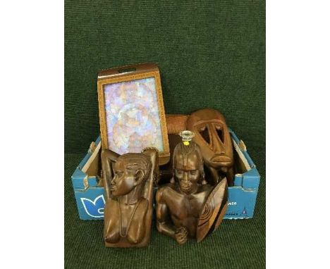 A box of inlaid butterfly tray, wooden candlesticks, tribal art etc 